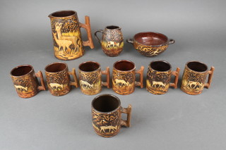 A Continental Earthenware drinks set comprising jug, 7 mugs, a bowl and jug 