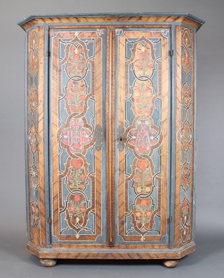 An 18th/19th Century Northern European painted pine cabinet with shelved interior enclosed by a pair of panelled doors, raised on bun feet 66"h x 51"w x 20 1/2"d 