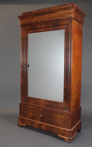 A 19th Century French walnut armoire with moulded cornice enclosed by a panelled door, the base fitted 1 long drawer and a secret drawer, raised on bracket feet 79 1/2"h x 42"w x 19 1/2"d 