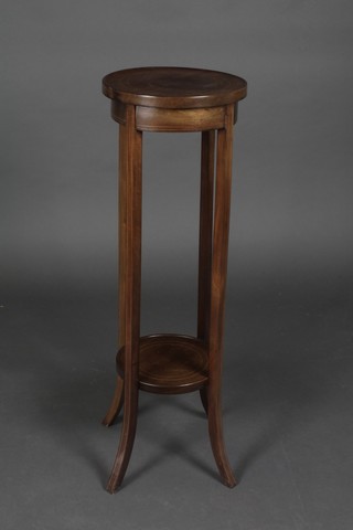 An Edwardian circular inlaid mahogany 2 tier jardiniere stand on outswept supports 36 1/2"h x 12" diam.