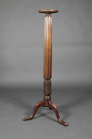 A 19th Century mahogany bed post torchere, raised on cabriole supports 51"h x 9" diam. 