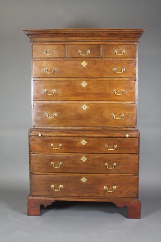 A George III Country oak chest on chest, having a moulded cornice above 3 short and 3 long drawers, the base fitted a brushing slide above 3 graduated drawers 71"h x 43 1/2"w x 22"d 