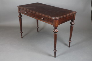 A Victorian side table fitted 2 frieze drawers, raised on turned supports 29"h x 43 1/2"w x 23 1/2"d 
