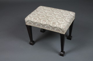 An Edwardian Georgian style rectangular mahogany stool with upholstered seat raised on square tapering supports ending in spade feet 18 1/2"h x 13"w 