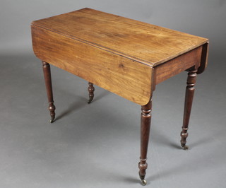 A Victorian mahogany Pembroke table, raised on turned supports, brass caps and casters 27"h x 36"w, when closed x 18", when open x 33" 