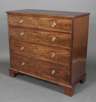 A 19th Century mahogany chest with crossbanded top, fitted 3 long drawers with brass escutcheons and oval drop handles, raised on bracket feet 39"h x 42 1/2"w x 19"d 