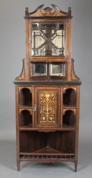A Victorian inlaid rosewood double corner cabinet, the upper section with broken pediment, the interior with mirrored back above a recess, the base fitted a  cupboard enclosed by an inlaid panelled door flanked by 4 niches above recess and with bobbin turned decoration, 78"h x 30"w x 17"d 