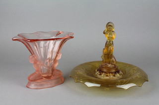 An Art Deco pressed amber glass table centre piece with goldfish and figural centre 10", a pink glass vase with kneeling figures 7"
