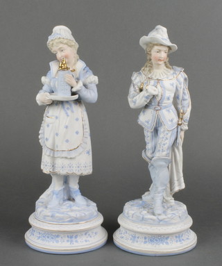 A pair of 19th Century German bisque figures of a lady and gentleman on raised rustic bases 12" 