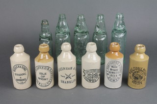 6 advertising stoneware bottles and 5 glass bottles