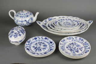 A Cauldon Meissen design blue and white pattern tea and dinner service comprising a teapot and cover, 7 side plates, 5 graduated plates, a dish and cover 