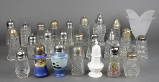 A collection of glass and ceramic sugar shakers