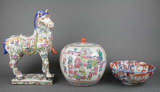 A 20th Century famille rose oviform vase and cover decorated with panels of figures 10", a modern Chinese polychrome figure of a horse and an Imari bowl