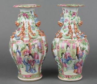 A pair of 19th Century famille rose baluster vases with waisted necks and stylised dragon handles, decorated panels of figures in pavillion settings 8" 