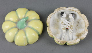 A Chinese yellow glazed squat melon box revealing a couple getting intimately acquainted 3"