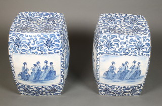 A pair of 20th Century Chinese blue and white garden barrel seats, the floral ground with panels of figures at pursuits 19" 
