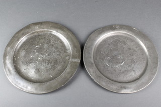 A pair of 18th/19th Century pewter plates both with touch marks 9" 