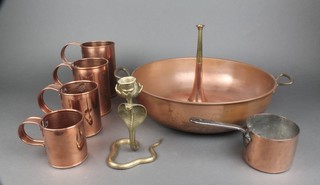 A 19th Century copper saucepan with polished iron handle 4", a reproduction copper twin handled bowl 16", 4 graduated copper measures, a reproduction copper and brass hunting horn and a brass candlestick in the form of a cobra 
