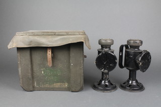2 WWII Military issue hand candle lanterns with deflectors contained in a wooden box 