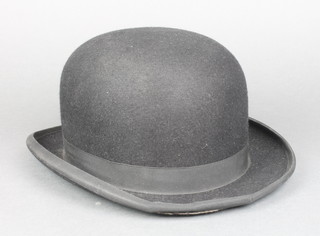 A gentleman's black bowler hat by Lock (some damage to rim)