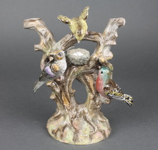A 19th Century Continental porcelain table centre piece base in the form of an arbour with birds and birds nest (f and r) 7"h