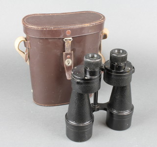 A pair of binoculars complete with leather case