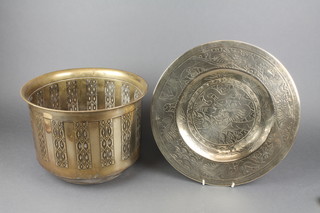 A circular Art Nouveau embossed brass jardiniere 11" and an engraved Chinese brass charger 14" 