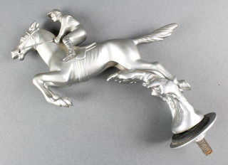 An Art Deco chrome car mascot in the form of a jumping horse with jockey, marked Desmo 