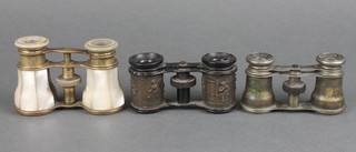 A pair of 19th Century gilt metal and mother of pearl opera glasses and 2 other pairs of opera glasses