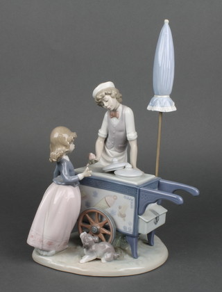 A 1985 Lladro figure in the form of an ice cream salesman, the base marked 325 9"