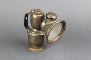A brass lantern with later added handle marked Lucas 