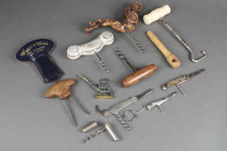 A 19th Century ivory and steel boot hook, a cork extractor and various corkscrews