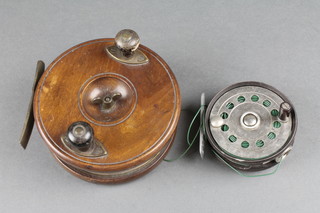 A 19th Century mahogany and brass star back centre pin fishing reel 5" together with a centre pin fishing reel 3", some chips to edge