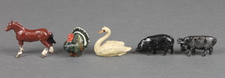 A metal figure of a standing horse, ditto swan, 2 black pigs and a turkey (foot f) 