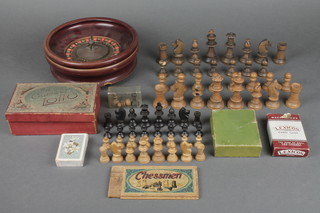 A Staunton pattern chess set - 3 pawns missing, a Staunton pattern Chessman chess set, a wooden roulette wheel 8" and various card games