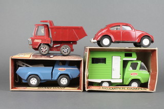 A Tonka Scamper Camper, do. Start Cart, both boxed, a Buddy L tipper truck, a Tonka model VW Beetle (front bumper f) 