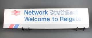 An enamelled railway sign - Network South Eastern, Welcome to Reigate 12" x 52" and 1 other enamelled sign 5 Car Stop 10" x 10"  