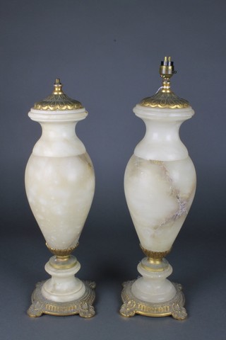 A pair of turned alabaster and gilt metal mounted club shaped table lamps 18" 