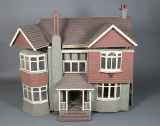A large 1930's wooden dolls house 41"h x 20"w x 55"d together with a collection of various dolls house furniture and fittings