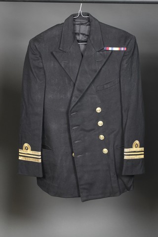 A quantity of various naval uniform relating to Lieutenant, later Lieutenant Commander Albert Frances Jarvis, Royal Naval Reserve, comprising Lieutenant Commanders tunic and trousers by Burtons, ditto mess kit with jacket and waistcoat by William Anderson & Sons Edinburgh and Glasgow, Lieutenant Great Coat by Miller Rayner & Hayson London & Liverpool, together with 2 officer's caps and framed warrant of commission 