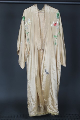 A Japanese peach and embroidered silk Kimono decorated birds amidst branches 