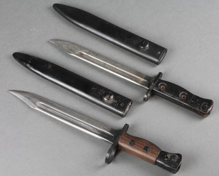 A bayonet with 8" blade dated 1947 complete with scabbard and 1 other 