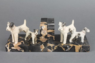 A pair of Art Deco marble and cold painted spelter bookends in the form of standing terriers 3 1/2" 