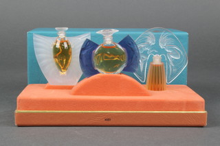 A boxed set of 3 Lalique scent bottles Les Introuvables 2 1/2" 