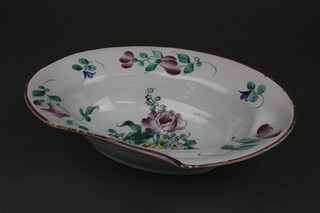 A St Clement Delft style bleeding/shaving bowl with floral decoration, base marked K & G St Clement 10" 