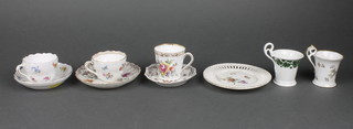 A Meissen cabinet cup and saucer with floral decoration, the base with cancellation mark, 2 Dresden style floral cabinet cups and saucers, 2 ditto cups with floral decoration and a circular porcelain ribbon ware plate 5"  