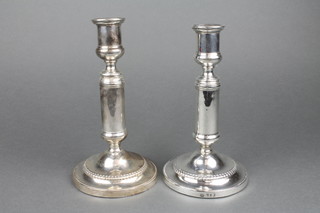 A pair of George III silver telescopic candlesticks of plain form with egg and dart decoration, marks rubbed  