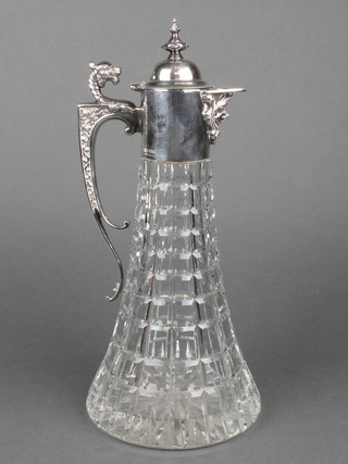 A 20th Century silver mounted cut glass spirit decanter with serpent scroll handle, scroll spout and faceted body 12" 