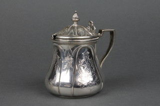 A mid Victorian silver pot with hinged lid and scroll handle decorated with panels of flowers, approx 192 grams 