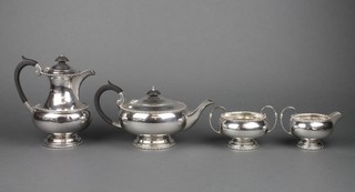 A silver 4 piece tea and coffee set with egg and dart decoration and ebony mounts, Sheffield 1934,gross approx 1554 grams 